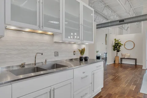 a living room with couches and pool table