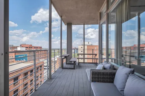 a view of a balcony with city view