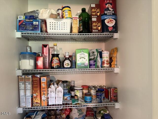 574 East Ridge Avenue Liberty, NC 27298 - Photo 25 of 28 a shelf with books and a shelf