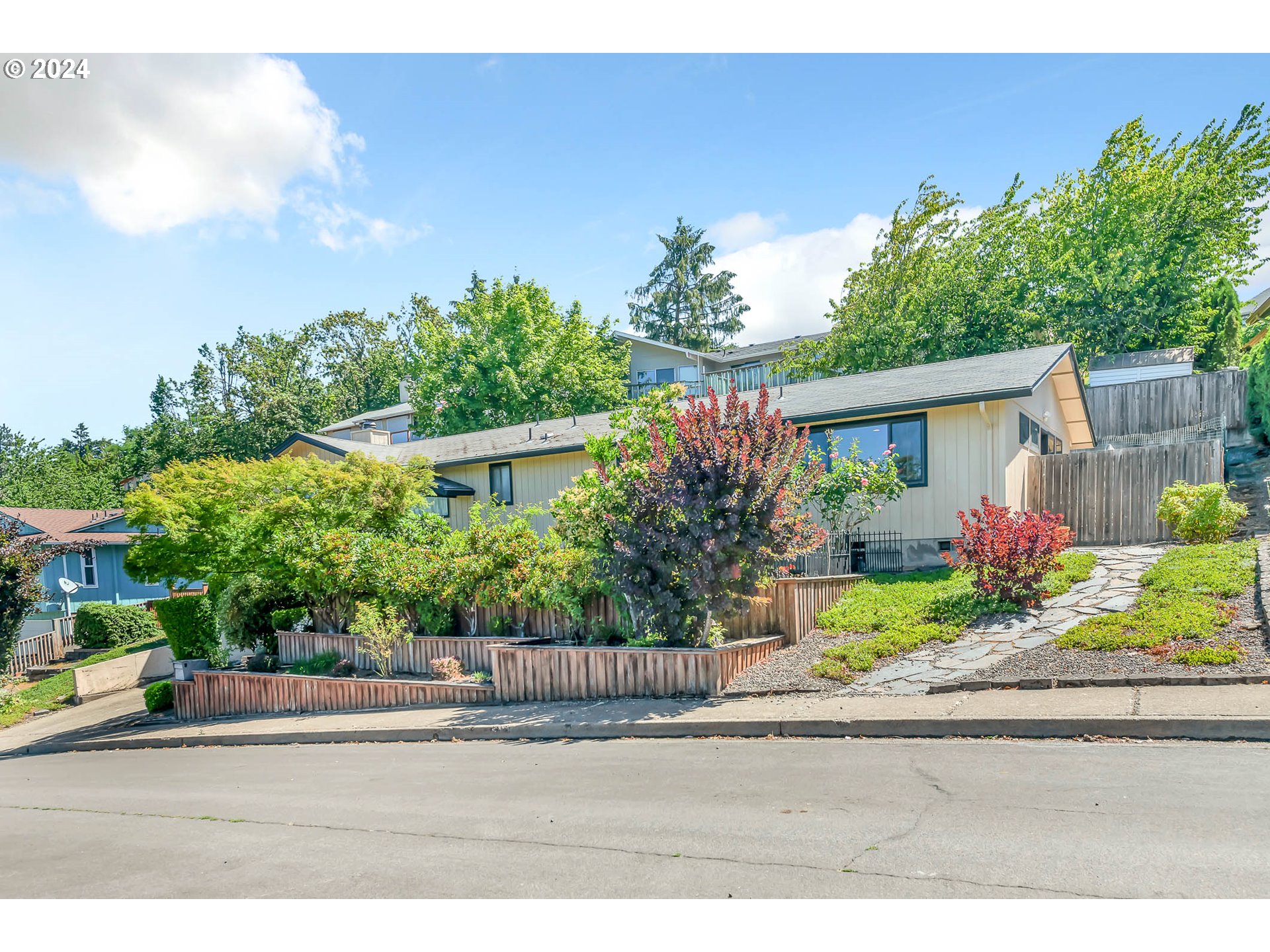 797 Prescott Lane Springfield, OR 97477 - Photo 3 of 43 a front view of a house with a yard and potted plants