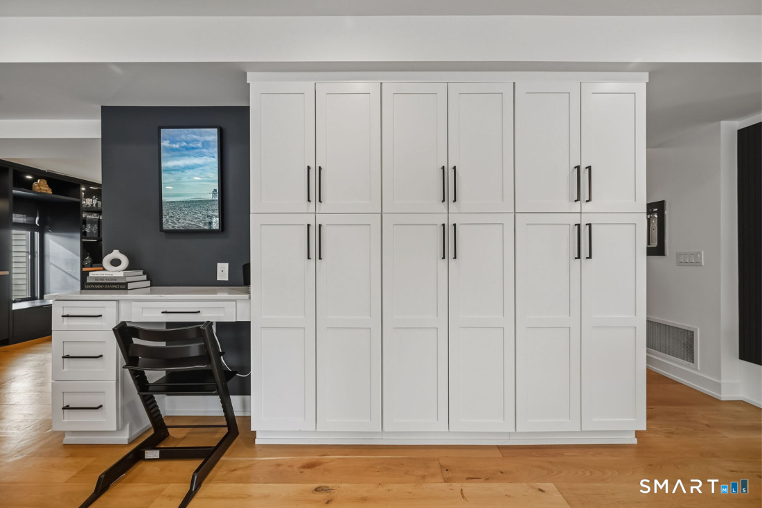 187 Catherine Terrace Fairfield, CT 06824 - Photo 11 of 40 "Command Central" featuring custom desk and wall of built-in storage.