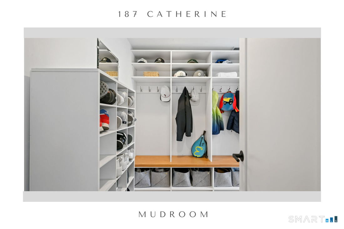187 Catherine Terrace Fairfield, CT 06824 - Photo 20 of 40 Huge fully built out mudroom with cubbies, shelving, and laundry alcove with floor to ceiling tiled wall.