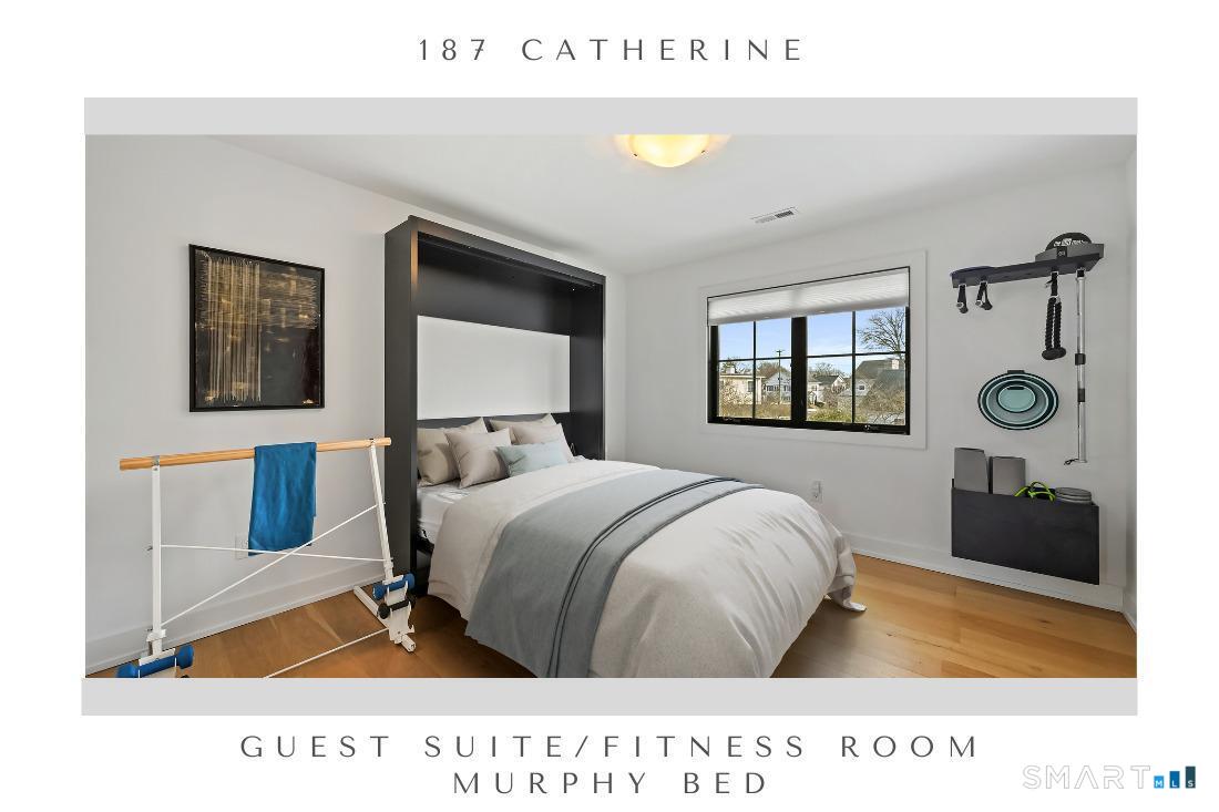187 Catherine Terrace Fairfield, CT 06824 - Photo 31 of 40 Custom fitted Murphy bed is perfect for this guest room with full bath en suite, mirrored double closets and currently doubles as a fitness center.