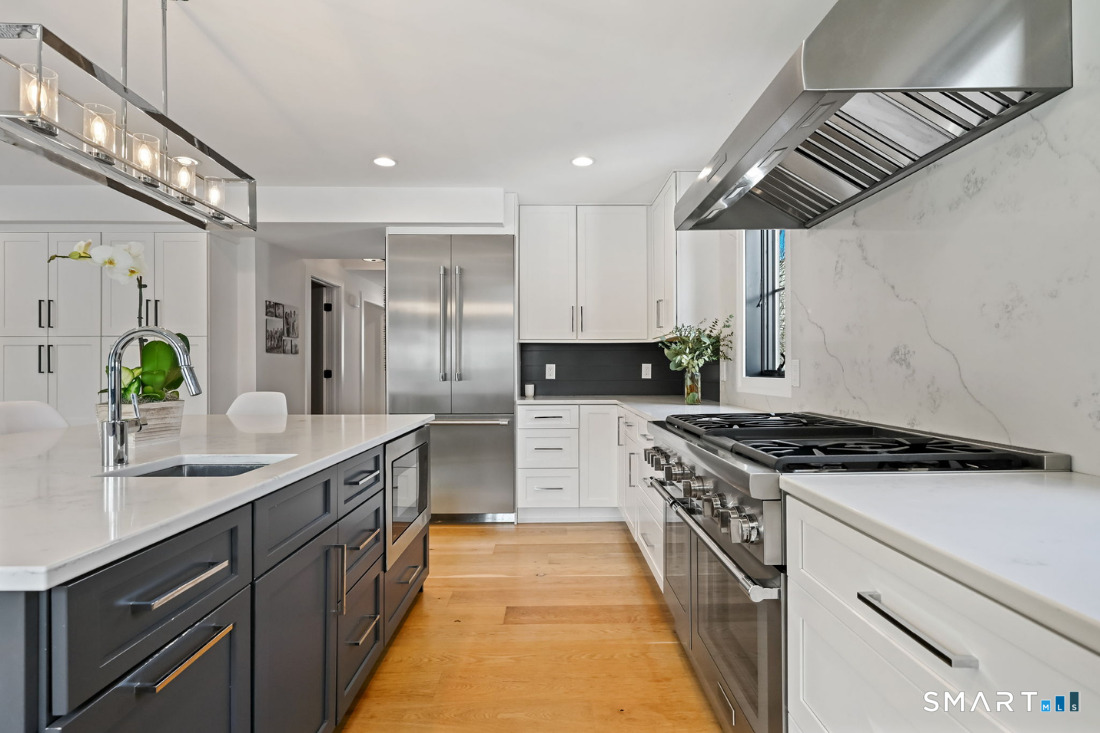 187 Catherine Terrace Fairfield, CT 06824 - Photo 5 of 40 Stainless steel suite of Thermador appliances including over-sized range with 6 burners and griddle.