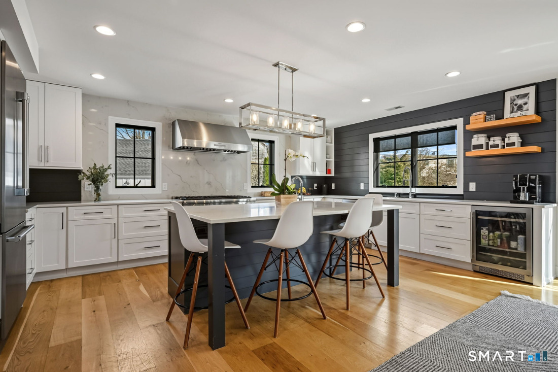 187 Catherine Terrace Fairfield, CT 06824 - Photo 6 of 40 We love the owner-curated features including floating oak shelves, island pendant and built-in Elkay water dispenser.