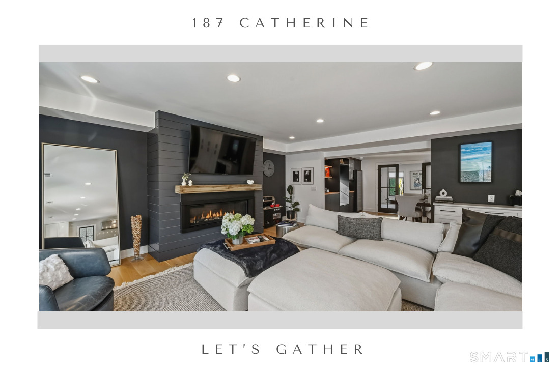 187 Catherine Terrace Fairfield, CT 06824 - Photo 7 of 40 Modern gas fireplace, built-in desk, open to kitchen and dining room with bar.