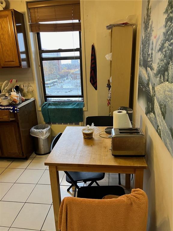 2400 East 3rd Street, Unit 529 Brooklyn, NY 11223 - Photo 2 of 7 a view of a dining room with furniture and window