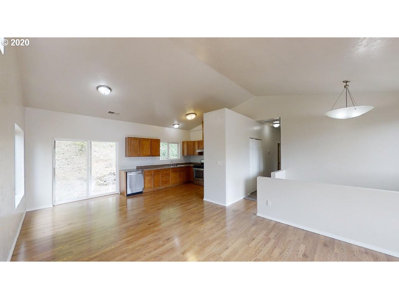 340 Kalapuya Way Cottage Grove, OR 97424 - Photo 2 of 20 a living room with furniture and a kitchen view