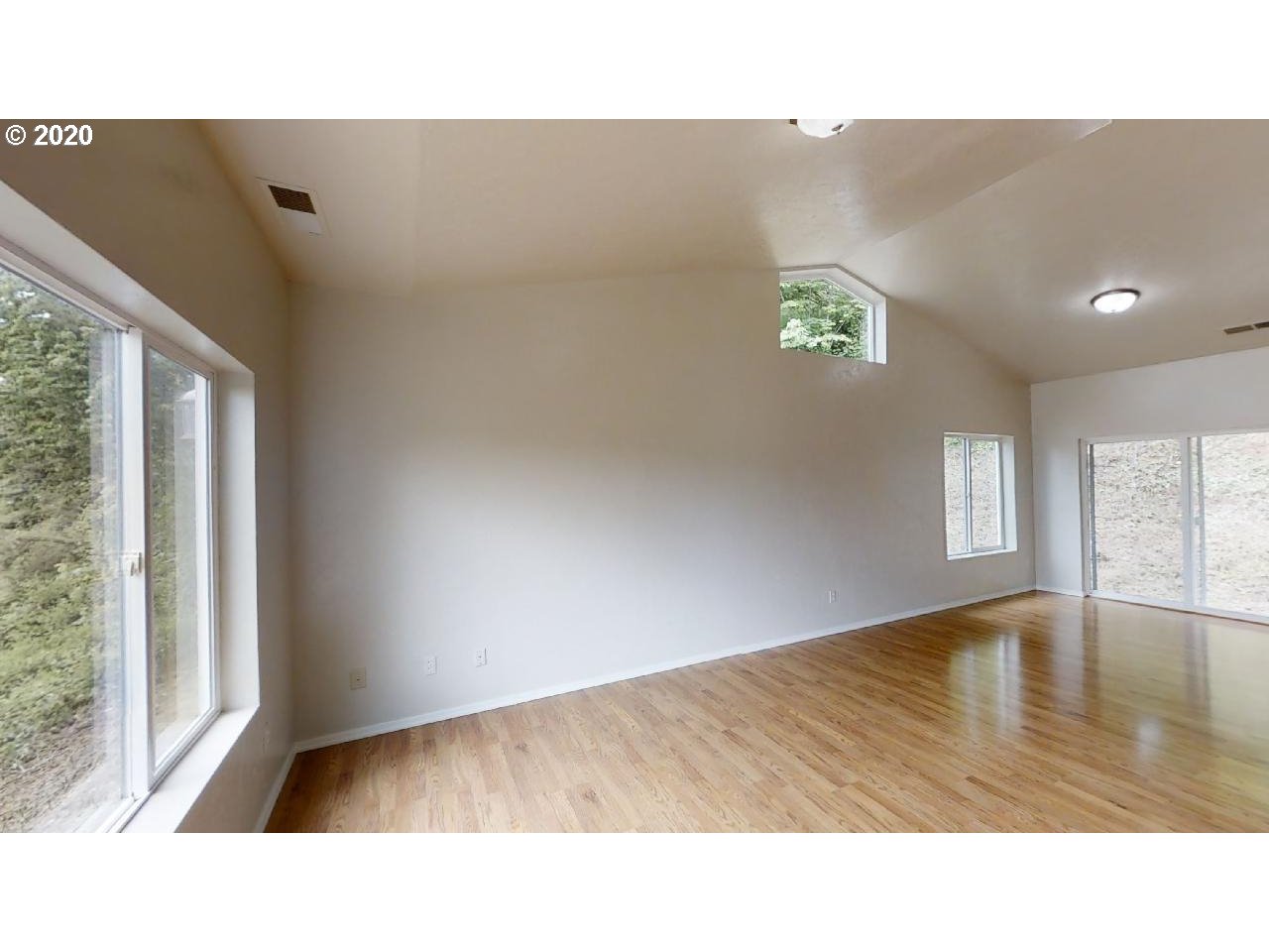 340 Kalapuya Way Cottage Grove, OR 97424 - Photo 3 of 20 a picture of an empty room with a window