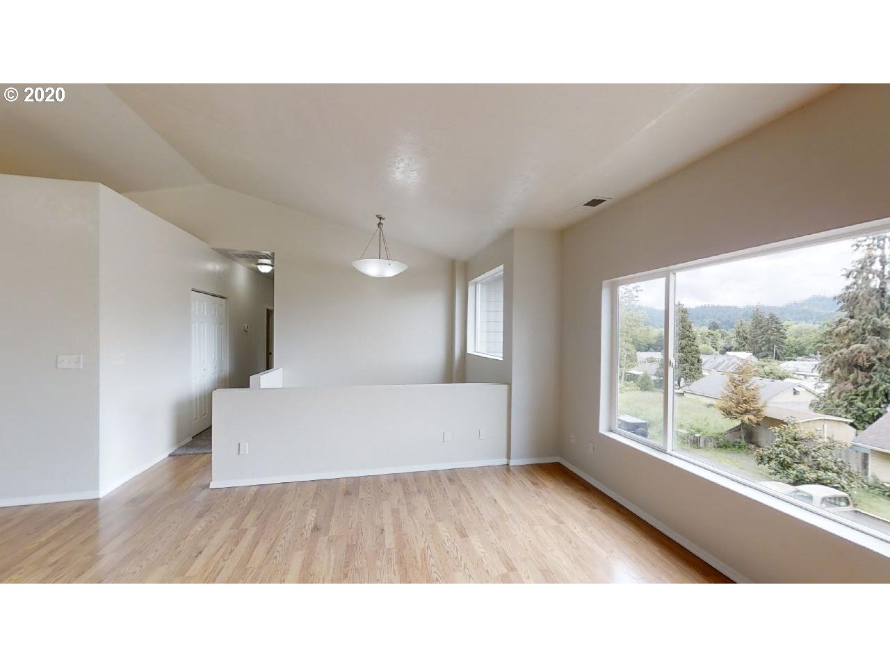 340 Kalapuya Way Cottage Grove, OR 97424 - Photo 4 of 20 a living room with a couch and large window