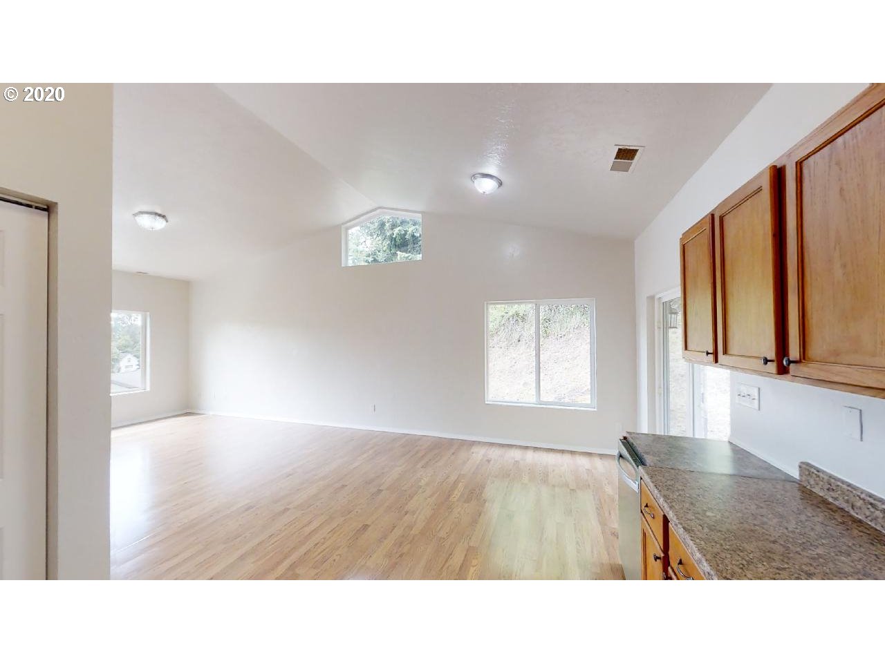 340 Kalapuya Way Cottage Grove, OR 97424 - Photo 9 of 20 a open kitchen with window and a fireplace