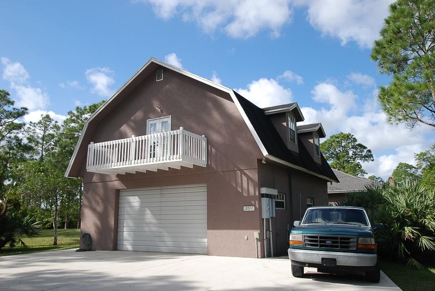 12557 154th Road North Jupiter, FL 33478 - Photo 29 of 38 a car parked in front of a house