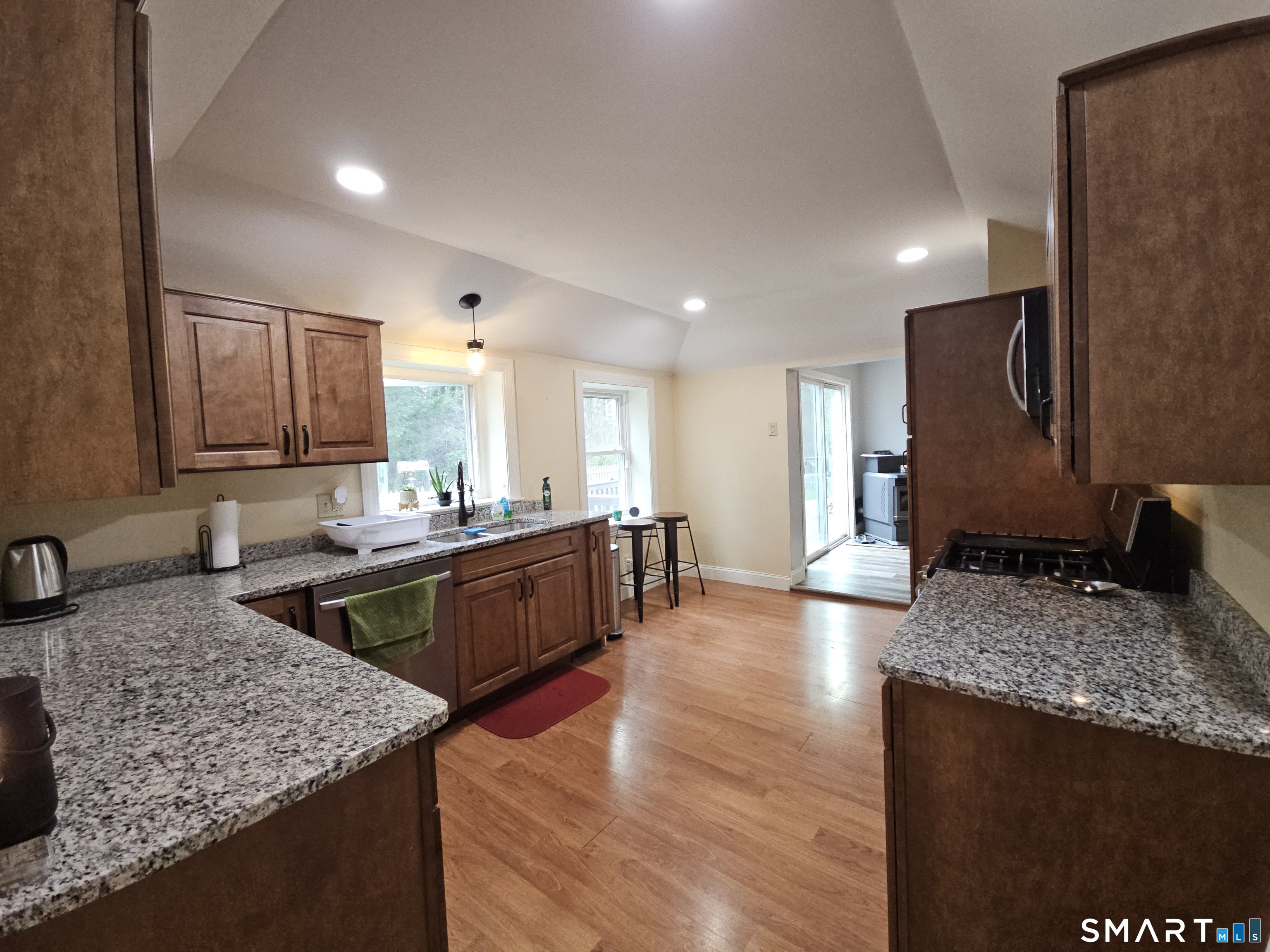 4 Breaults Landing Road Thompson, CT 06277 - Photo 13 of 39 a kitchen with large counter space and wooden floor