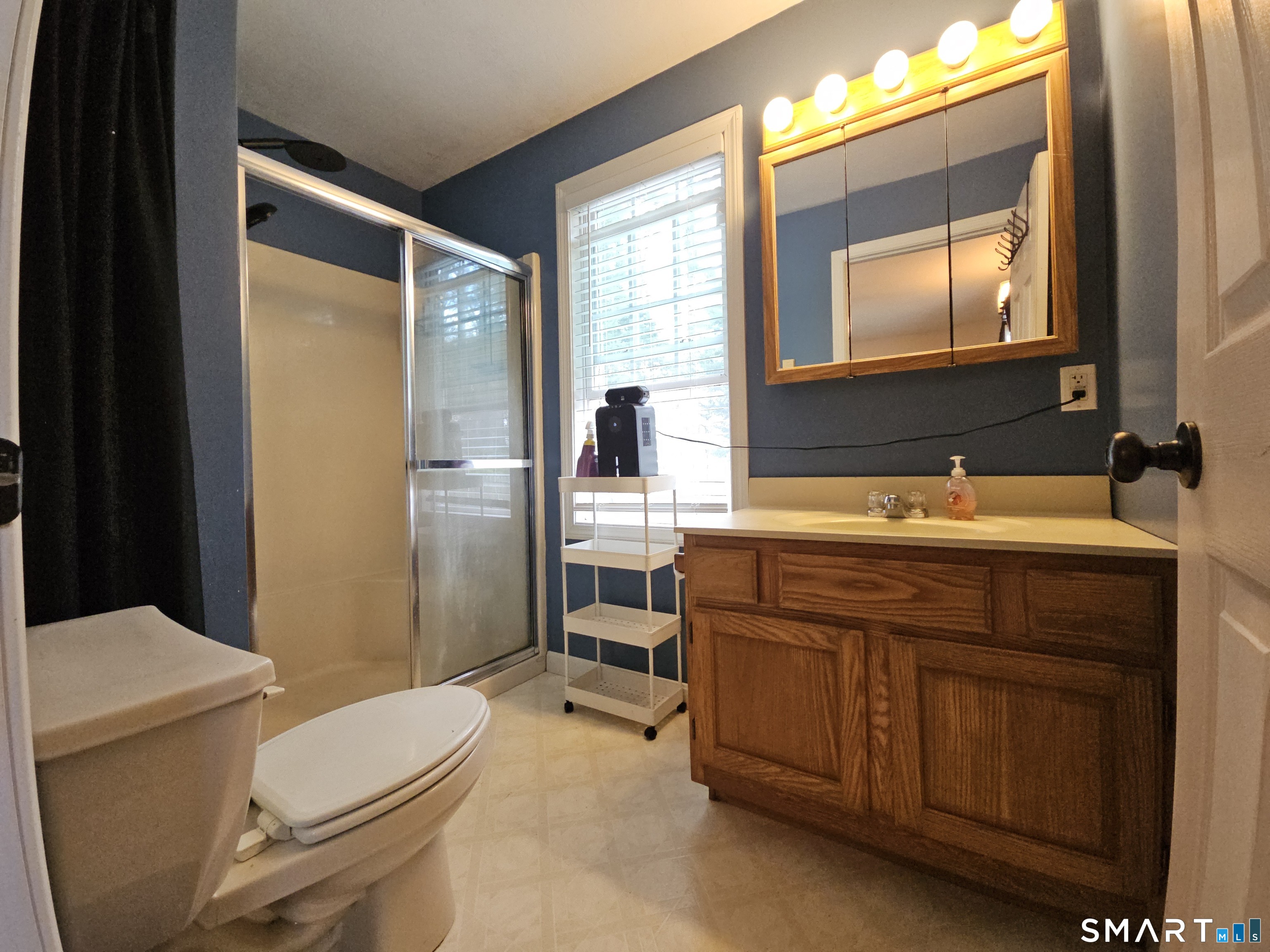 4 Breaults Landing Road Thompson, CT 06277 - Photo 18 of 39 a bathroom with a granite countertop toilet sink and mirror