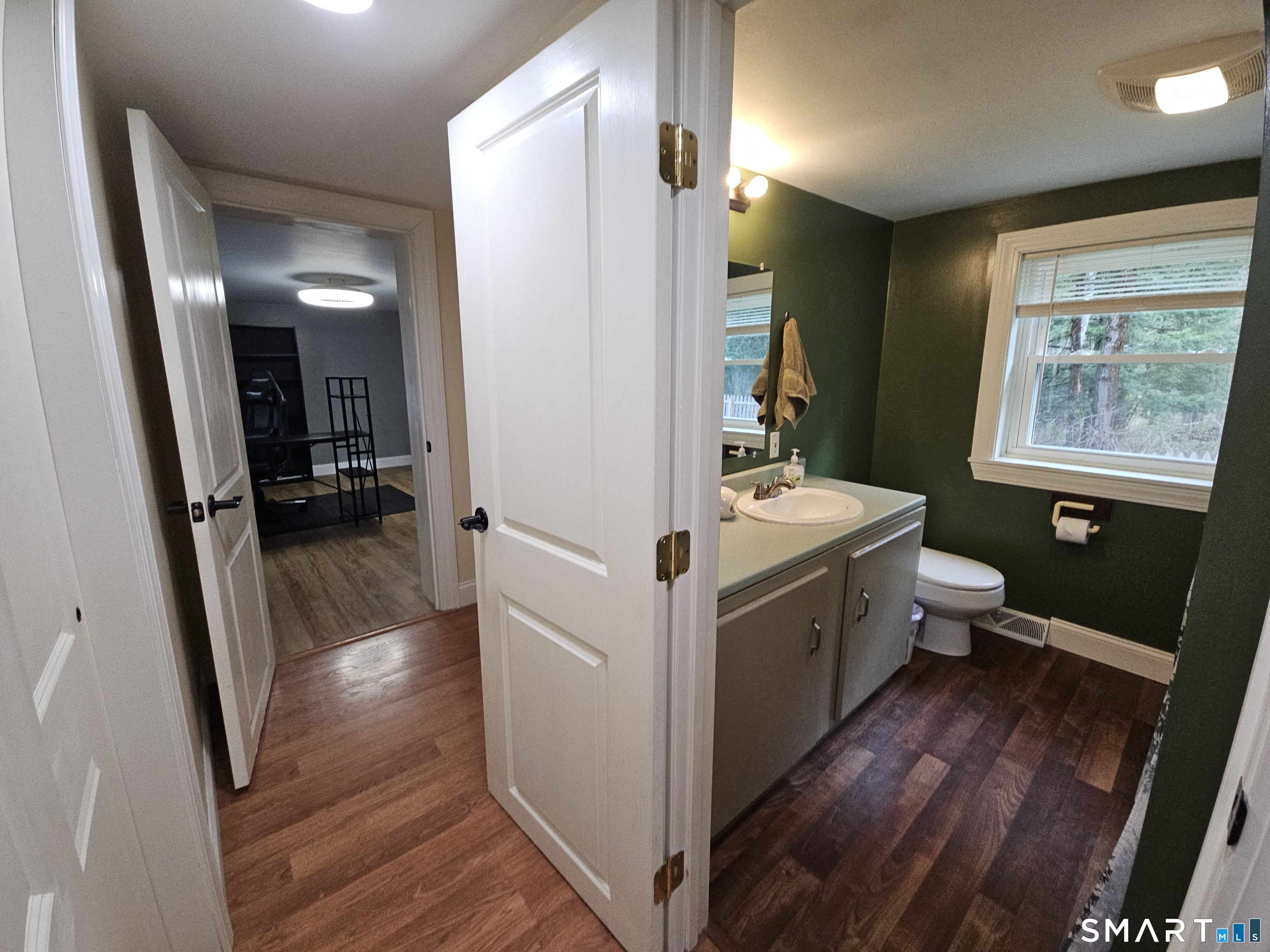 4 Breaults Landing Road Thompson, CT 06277 - Photo 20 of 39 a bathroom with a sink a toilet a mirror and shower