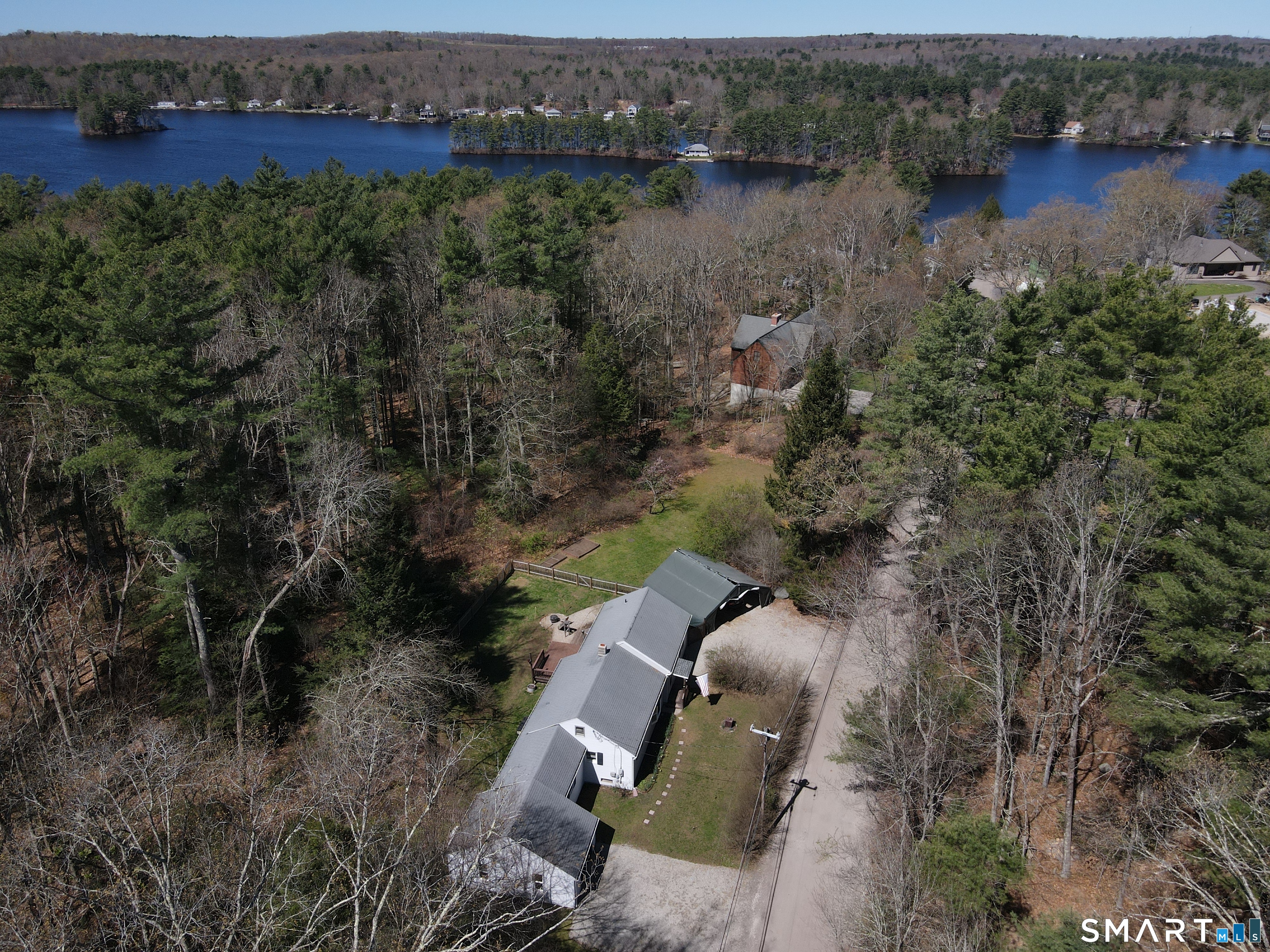 4 Breaults Landing Road Thompson, CT 06277 - Photo 2 of 39 an aerial view of a house with a yard and lake view