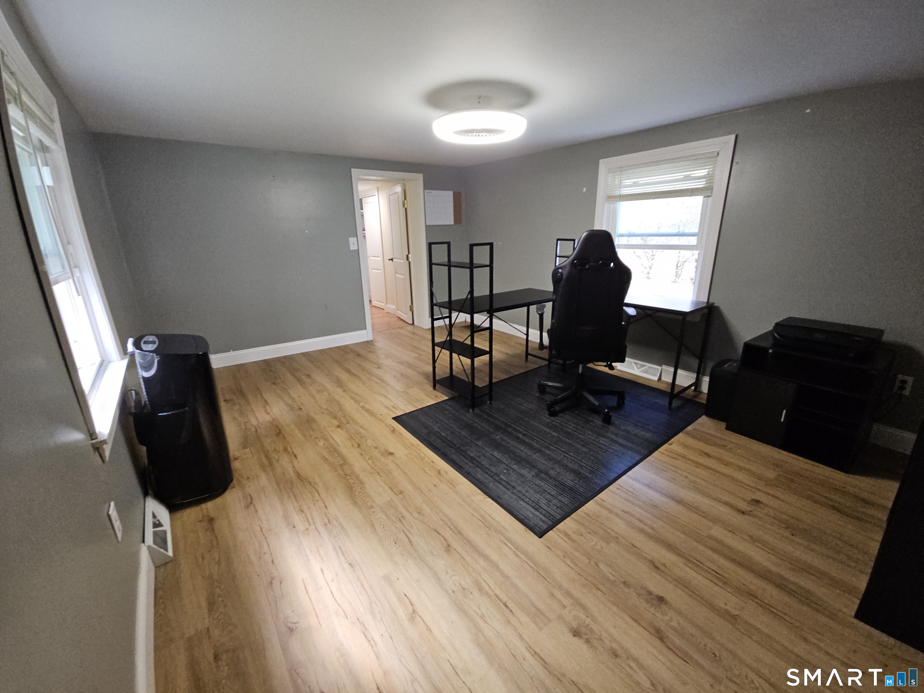 4 Breaults Landing Road Thompson, CT 06277 - Photo 22 of 39 a living room with a bed furniture and a wooden floor