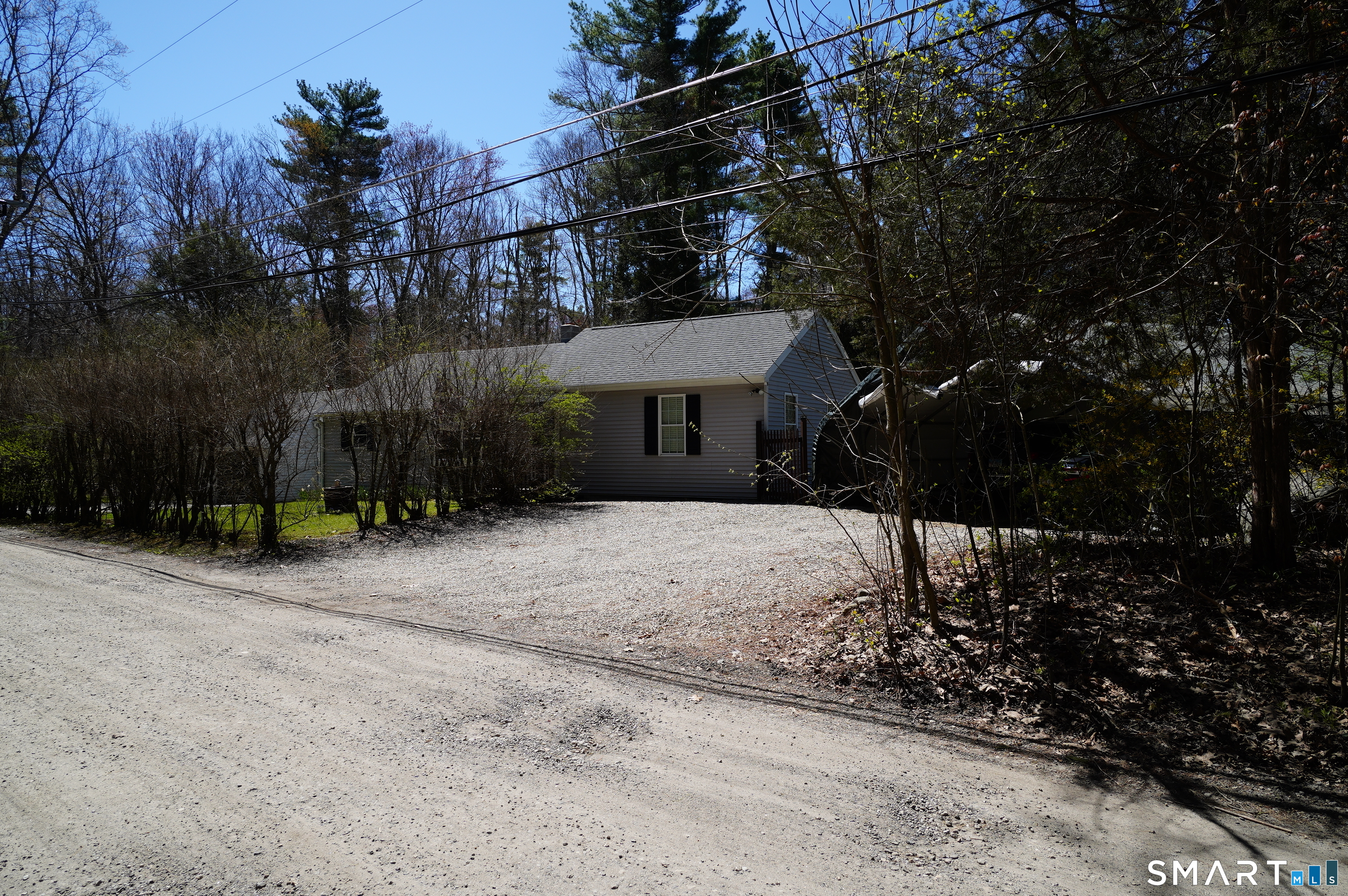 4 Breaults Landing Road Thompson, CT 06277 - Photo 34 of 39 a front view of a house with a yard