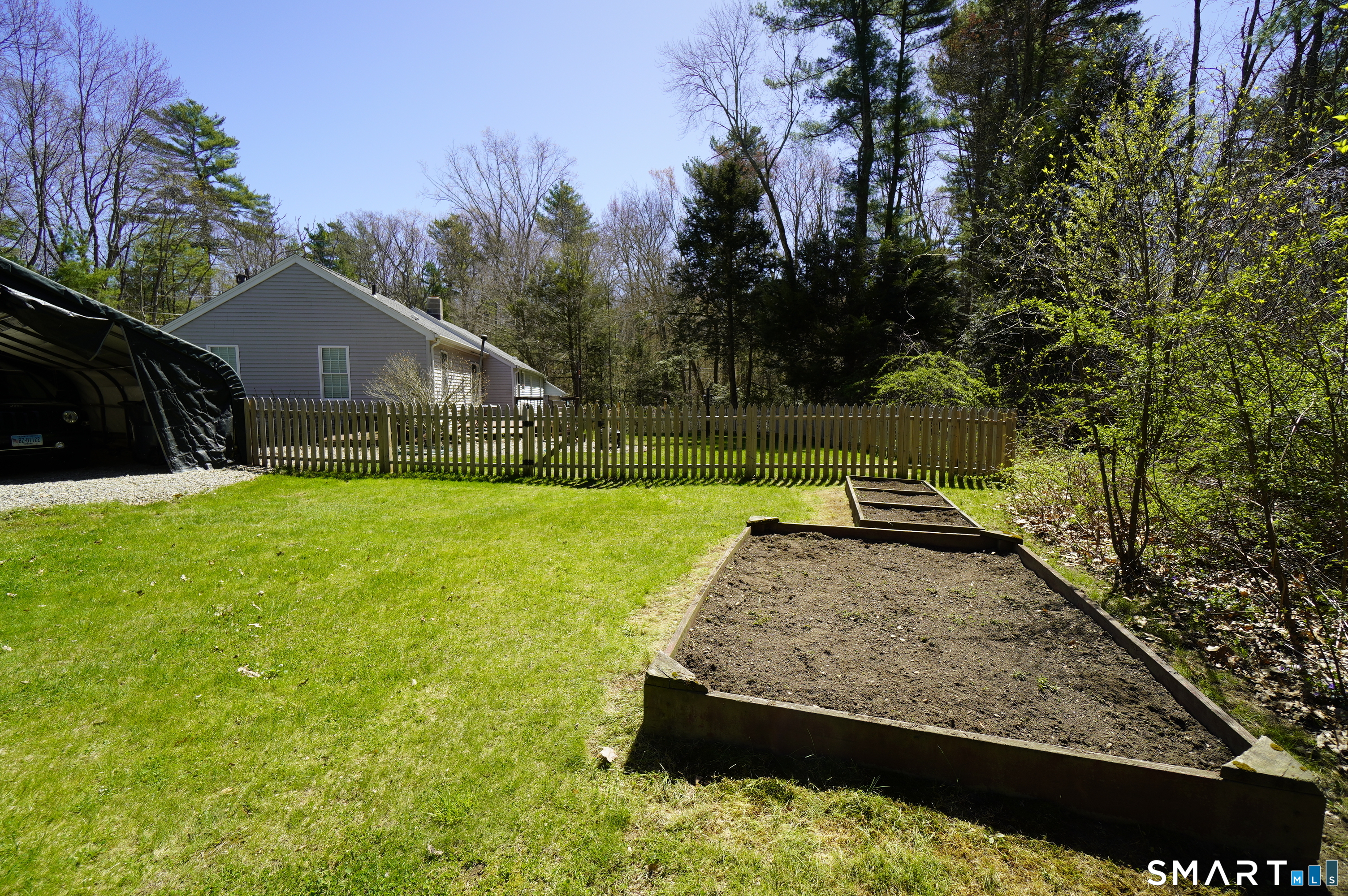 4 Breaults Landing Road Thompson, CT 06277 - Photo 36 of 39 a view of a backyard with a garden