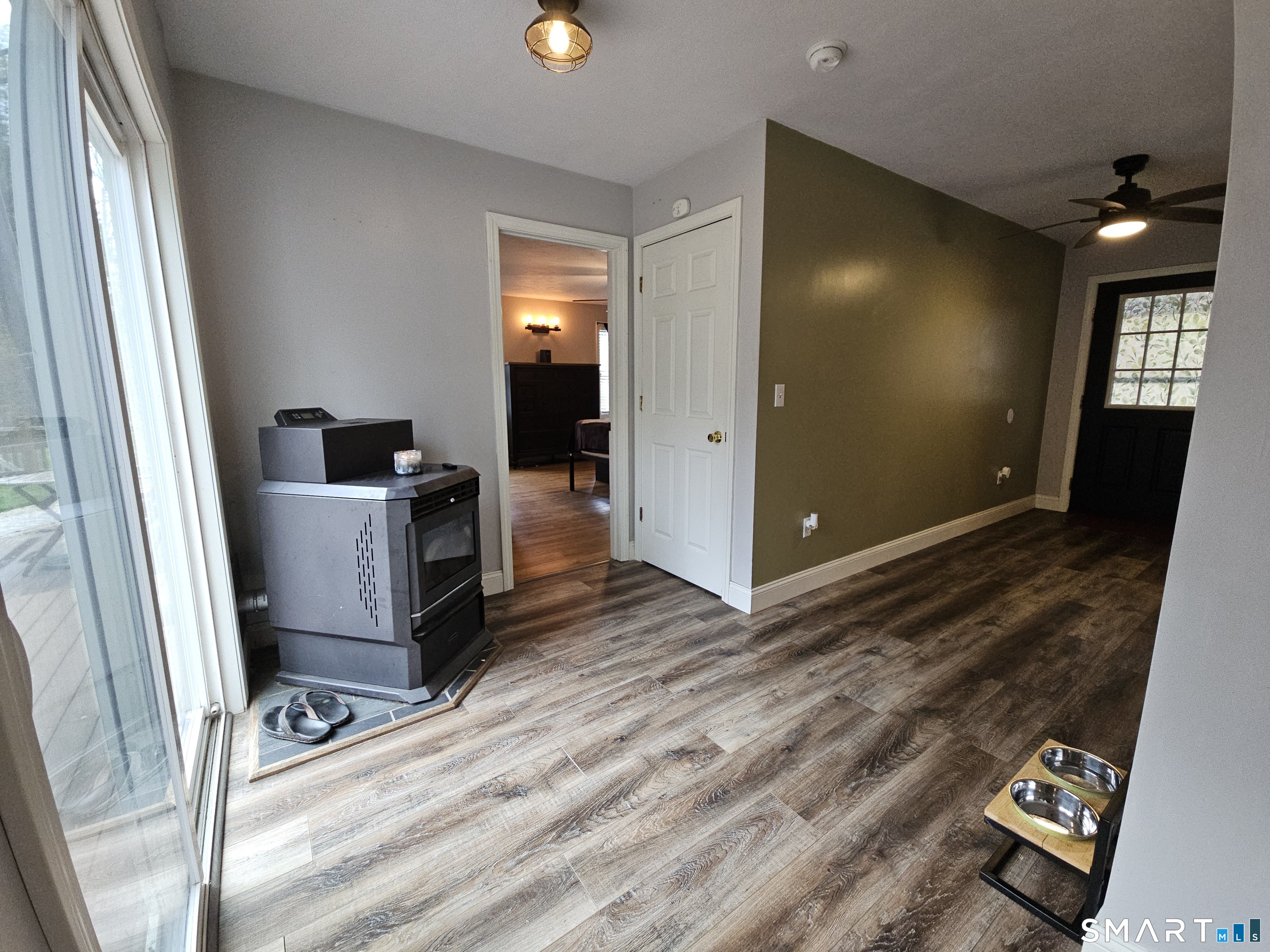 4 Breaults Landing Road Thompson, CT 06277 - Photo 8 of 39 a view of a hallway with wooden floor and furniture