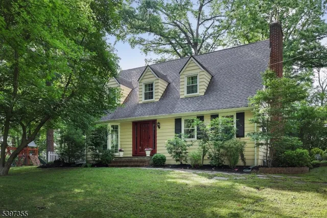 a house that has a tree in front of the house