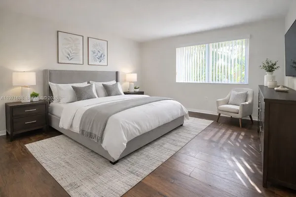 a bedroom with a bed and a couch