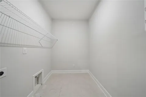 a view of a room with white walls