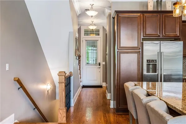 a view of kitchen with furniture and wooden floor
