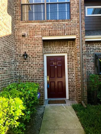 a view of front door of house and yard