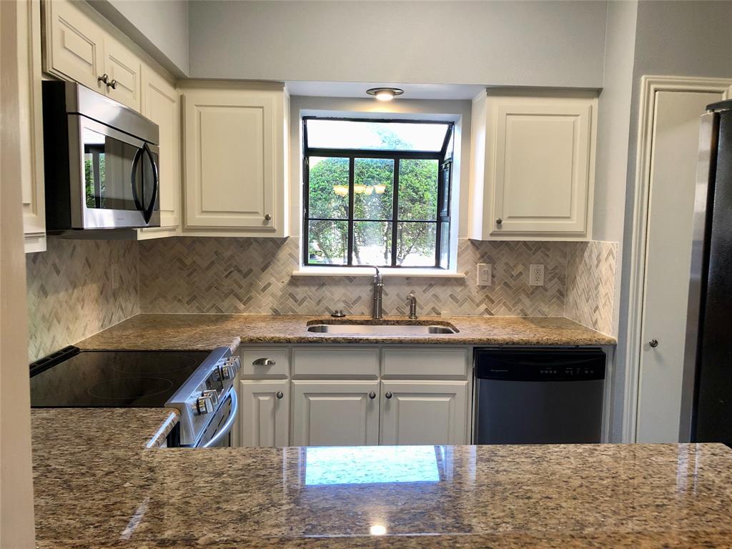 5859 Frankford Road, Unit 803 Dallas, TX 75252 - Photo 2 of 21 a kitchen with a sink and cabinets