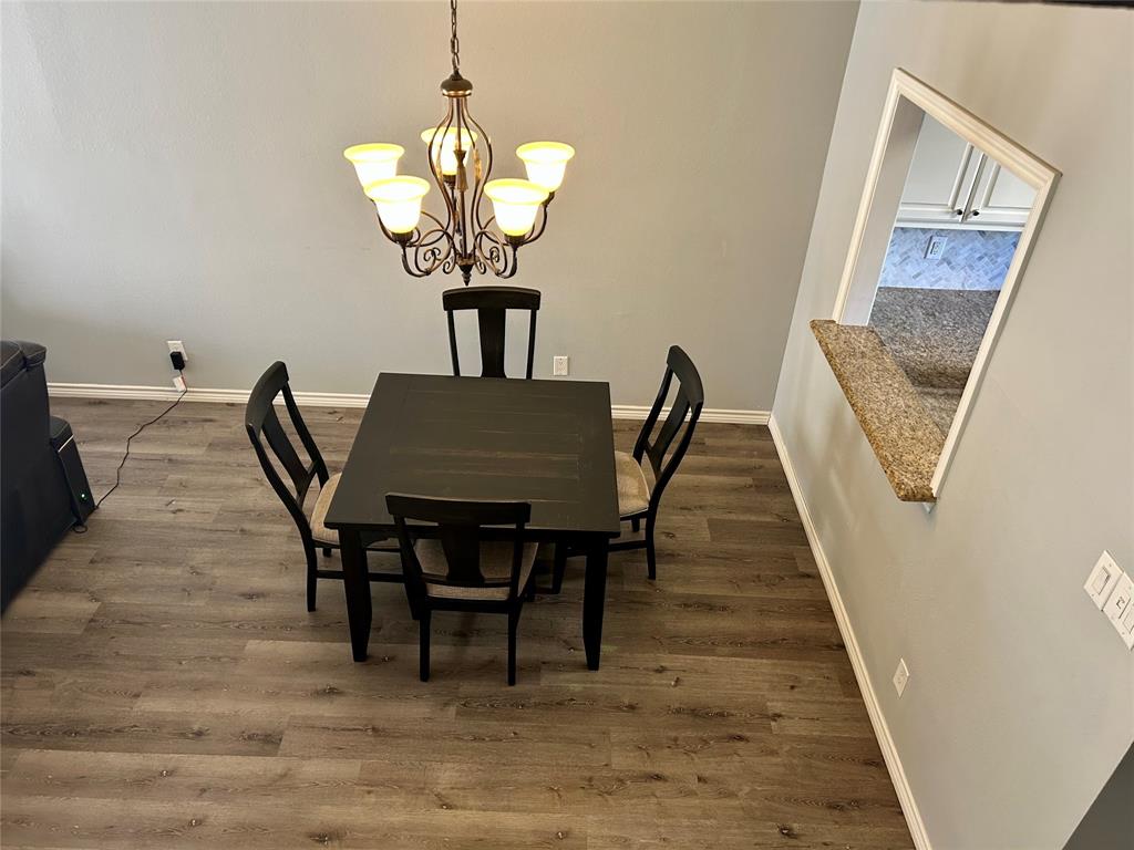 5859 Frankford Road, Unit 803 Dallas, TX 75252 - Photo 6 of 21 a view of a dining room with furniture and wooden floor