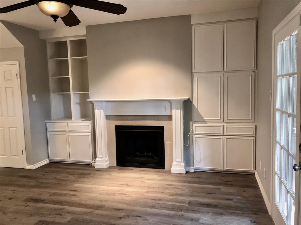 5859 Frankford Road, Unit 803 Dallas, TX 75252 - Photo 7 of 21 a view of a livingroom with a fireplace and cabinet
