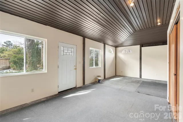 a view of an empty room with a ceiling fan
