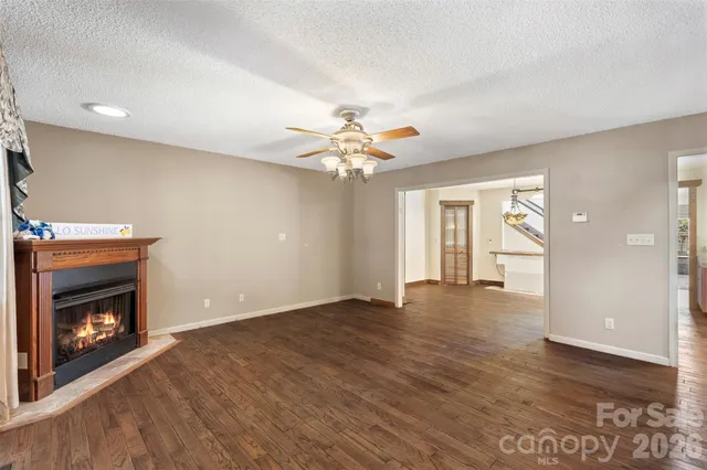 a kitchen with counter top space appliances and windows