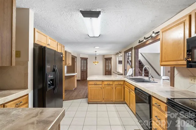 a bathroom with a sink a mirror and a shower