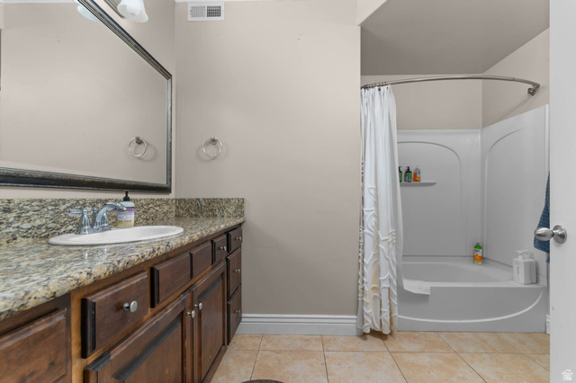476 West 200 N Street, Unit 206 Springville, UT 84663 - Photo 11 of 24 Bathroom with shower / bath combination with curtain, vanity, and light tile patterned floors