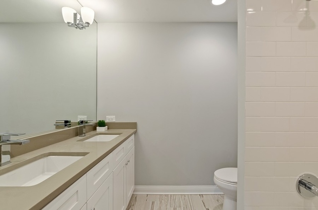 80 Ellendale Road Deerfield, IL 60015 - Photo 14 of 19 a bathroom with a granite countertop sink a toilet and a mirror