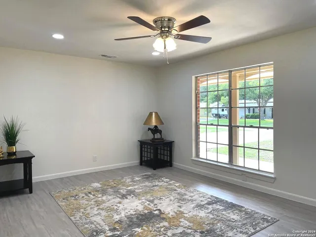 a living room with furniture and a window