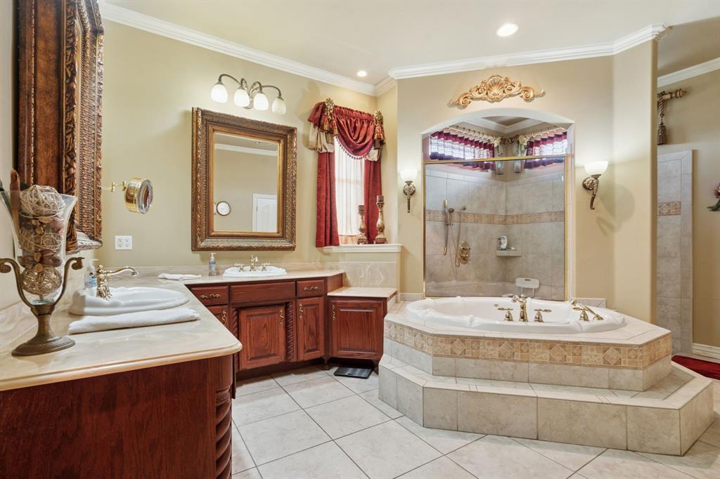 2308 Kella Court Haslet, TX 76052 - Photo 20 of 40 a spacious bathroom with a tub sink and mirror