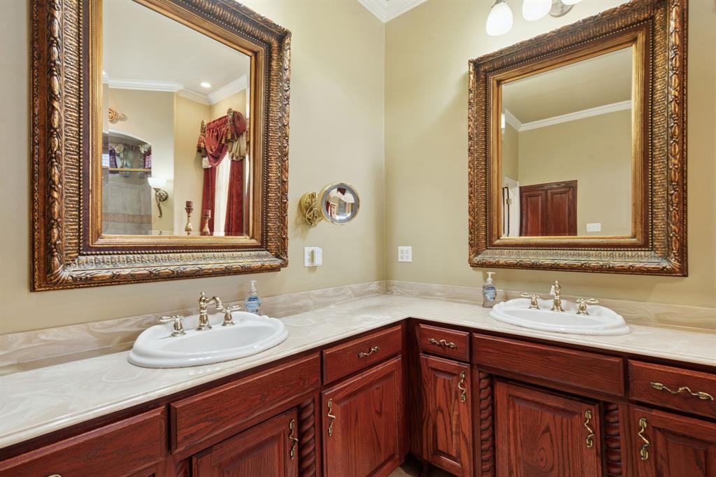 2308 Kella Court Haslet, TX 76052 - Photo 21 of 40 a bathroom with a sink and a mirror