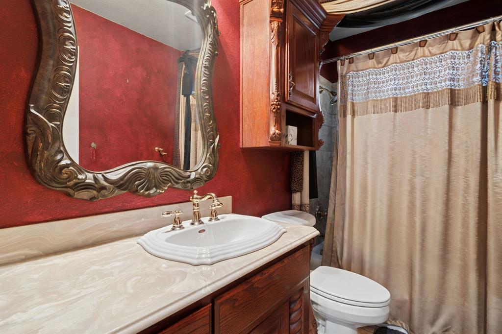 2308 Kella Court Haslet, TX 76052 - Photo 29 of 40 a bathroom with a sink toilet and shower