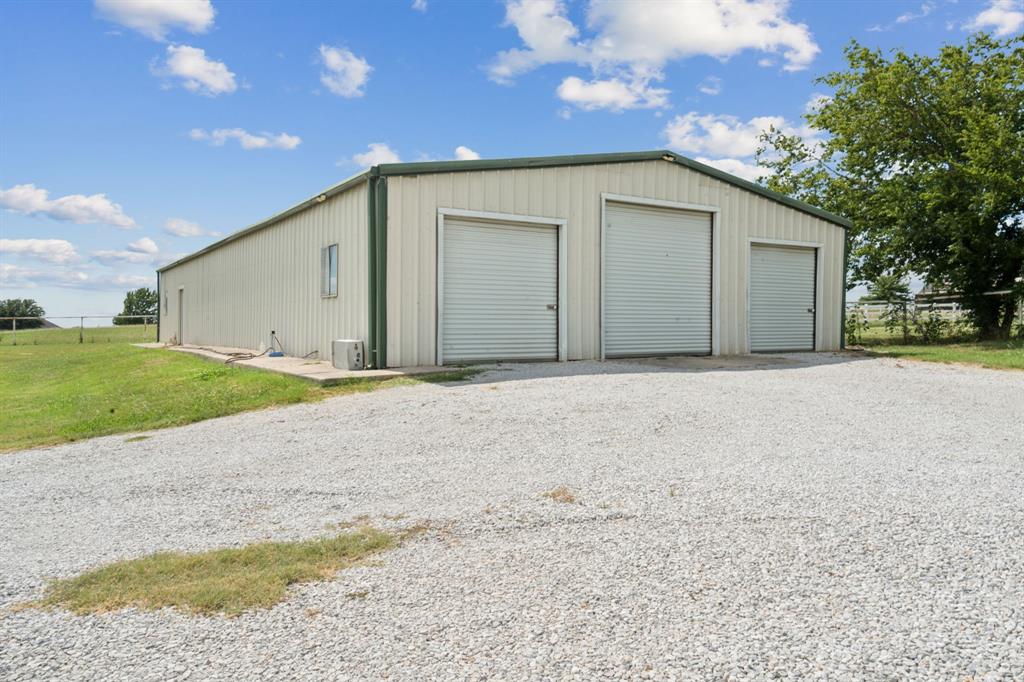 2308 Kella Court Haslet, TX 76052 - Photo 34 of 40 a front view of a house with a yard and garage