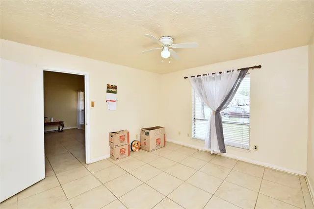 a view of a livingroom with a furniture and chandelier fan