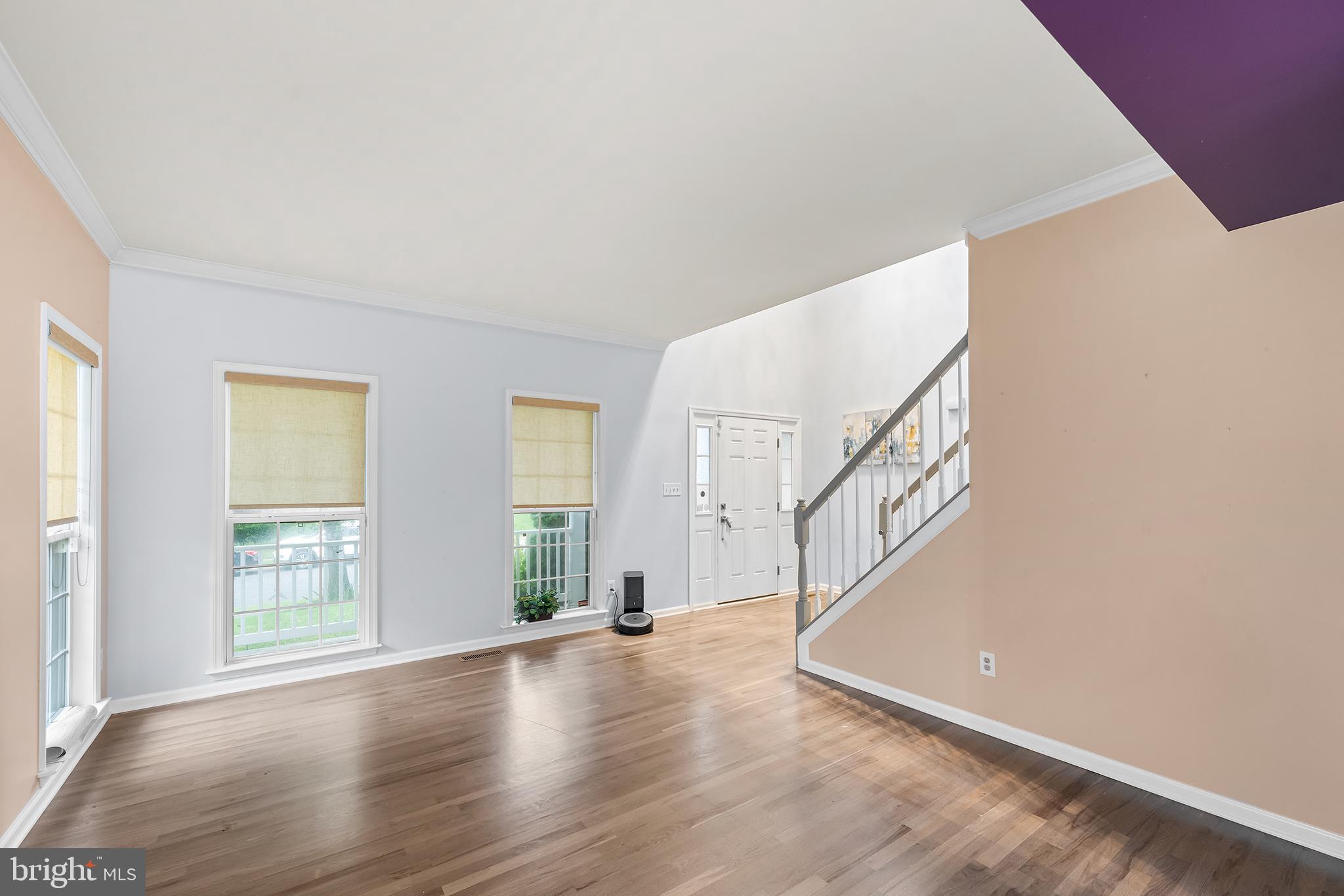 104 Constitution Terrace Elkton, MD 21921 - Photo 4 of 20 a view of an empty room with wooden floor and a window