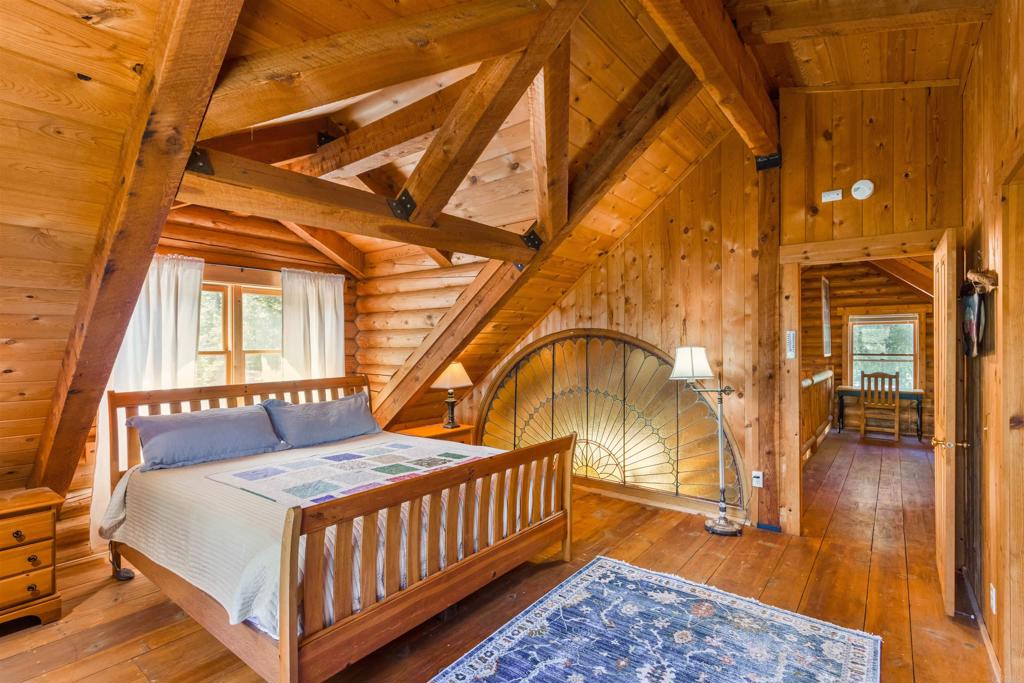 33480 Bailey Meadow Road Palomar Mountain, CA 92060 - Photo 30 of 51 a bedroom with a bed and wooden floor