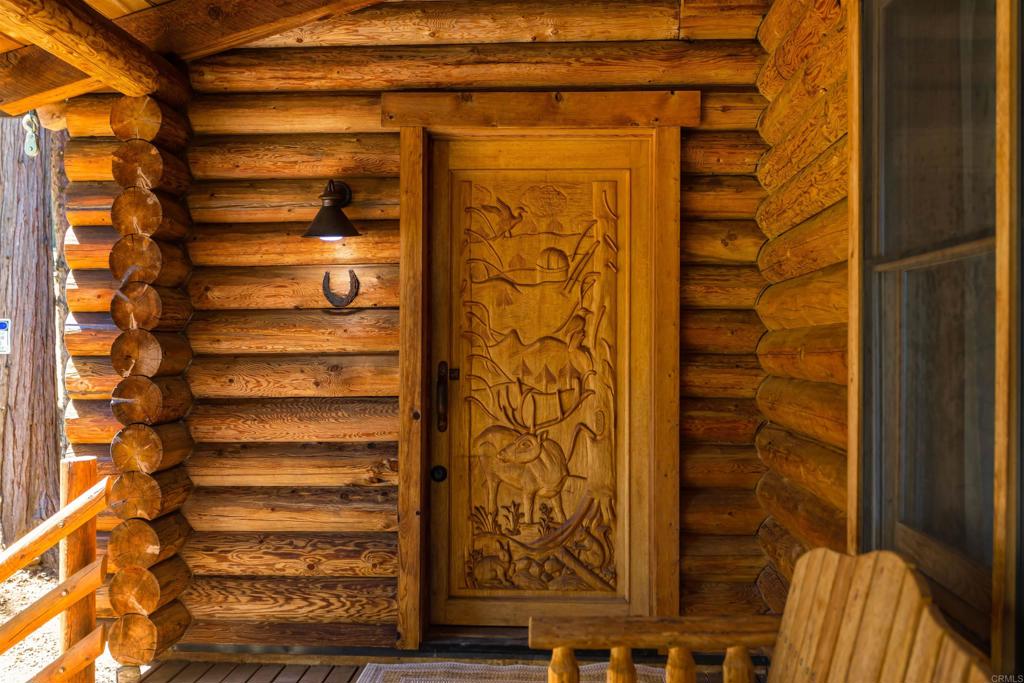 33480 Bailey Meadow Road Palomar Mountain, CA 92060 - Photo 6 of 51 a front view of a house with a glass door
