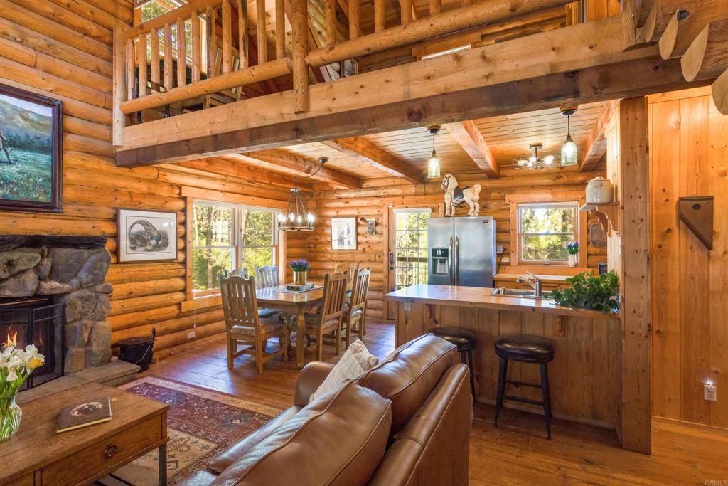 33480 Bailey Meadow Road Palomar Mountain, CA 92060 - Photo 10 of 51 a living room with furniture a large window and wooden floor