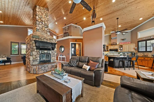 a bathroom with a granite countertop toilet sink and mirror