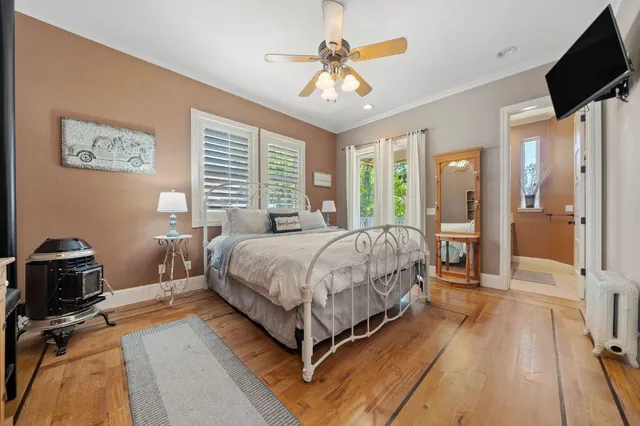 a bathroom with a granite countertop sink mirror and toilet