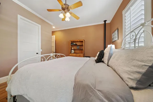 a spacious bathroom with a granite countertop sink and a mirror
